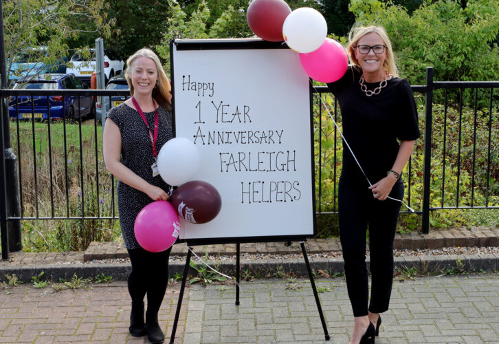 Farleigh Staff Michelle von Kimmelmann, Volunteer Manager and Deborah Durno, Volunteer Co-ordinator celebrating Farleigh Helpers one year anniversary