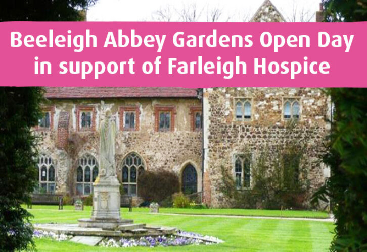 The front of Beeleigh Abbey showing the gardens, lawns and a historic building